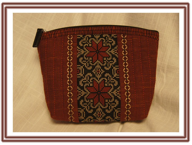 Cosmetic purse, decorated with cross stiches