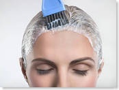 woman applying hair color