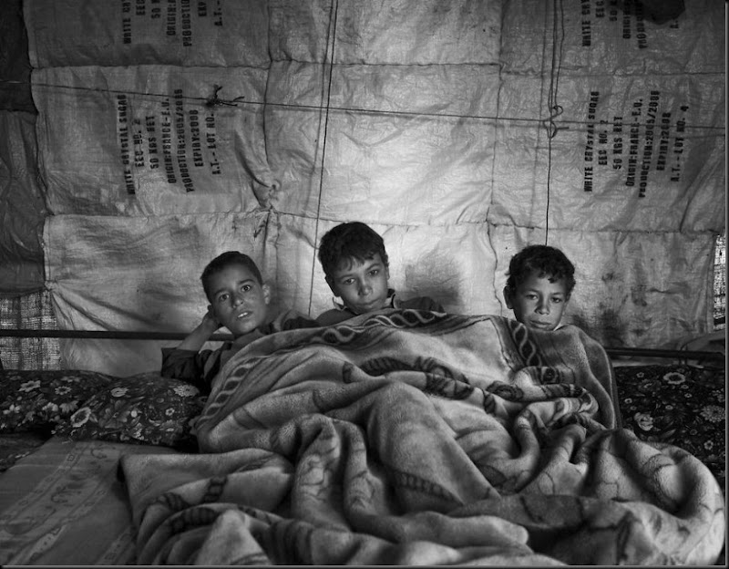 Syrian children waking up inside their tent in Lebanon's Bekaa Valley.  (Moises Saman/Magnum Photos for Save the Children)