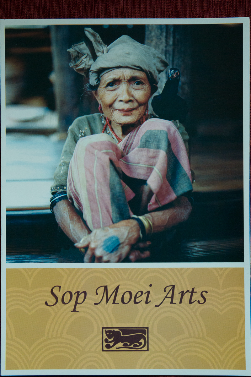 Sop Moei Arts brochure cover, photo of older rural woman in beautiful clothing