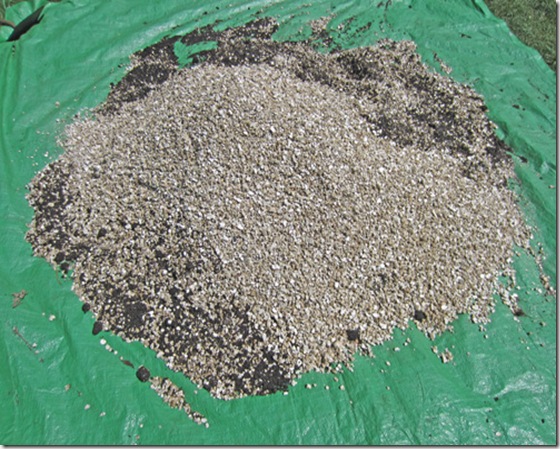 Vermiculite being blended with compost