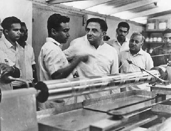 Dr. Vikram Sarabhai listening to a young Dr. APJ Kalam as he speaks, while Dr. Madhavan Nair, later ISRO Chair man looks on