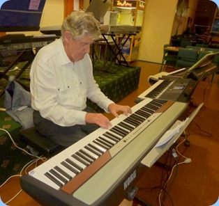 Ian Jackson playing the Korg SP-250 piano. Photo courtesy of Colleen Kerr.