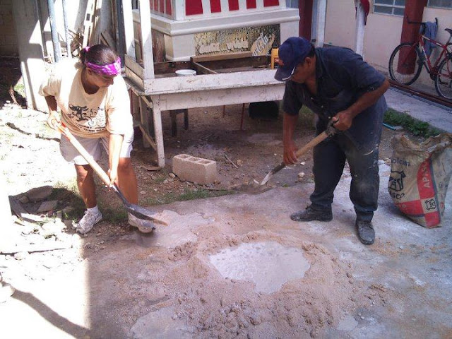 Debbie is trying her hand at mixing concrete, Mexican style.