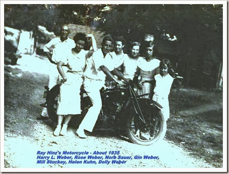 Uncle Harry Weber and Ray's cousins pose on his motorcycle.