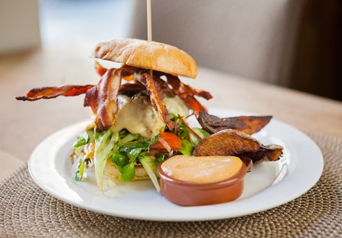 Bacon Burger on Plate in Restaurant