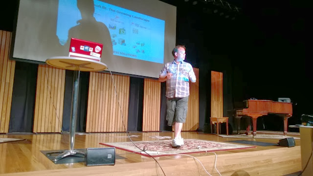 Chris presenting on stage