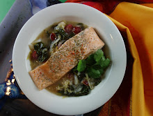 Salmon Poached in a Cranberry Ginger Broth over Greens