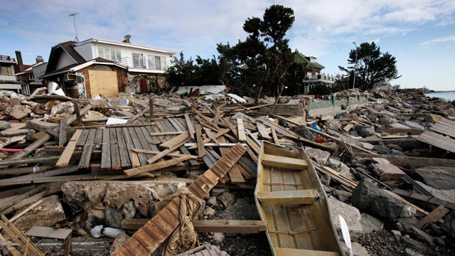 Debris sits in front of a beachfront home in the Manhattan Beach neighborhood of the Brooklyn, 5 November 2012, in New York. Mark Lennihan / AP Photo