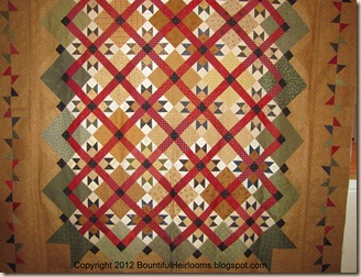 red green quilt with caption