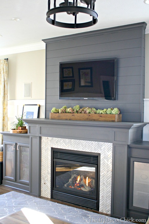 gray fireplace with marble surround