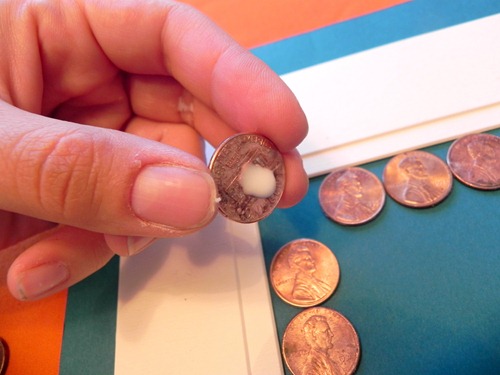 glue the pennies in place