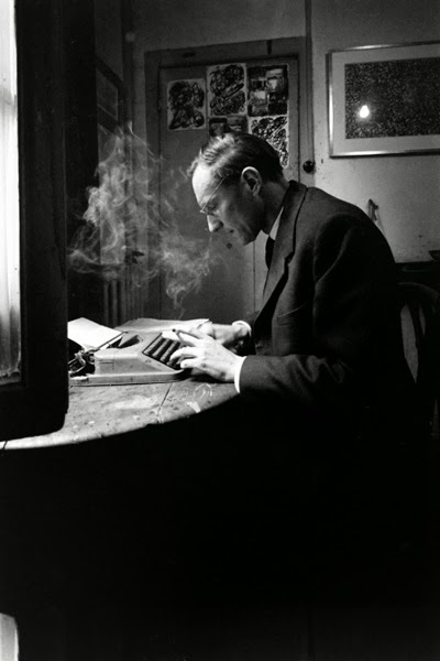 William S. Burroughs at his typewriter, Paris, 1959