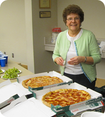 Janice Yuly serves pizza