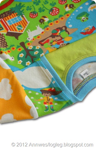 A little boy with an umbrella, upside down on the shoulder. Summer fabric designed by Johanna Ahlard. Sewn by Annwes.