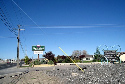 This is the driveway into the park, looking west.  Note the Westwind Homes sign and the smaller Rock Creek RV Park sign.
