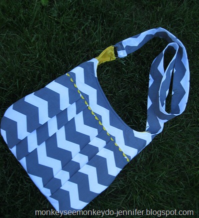 yellow and gray pleated chevron bag