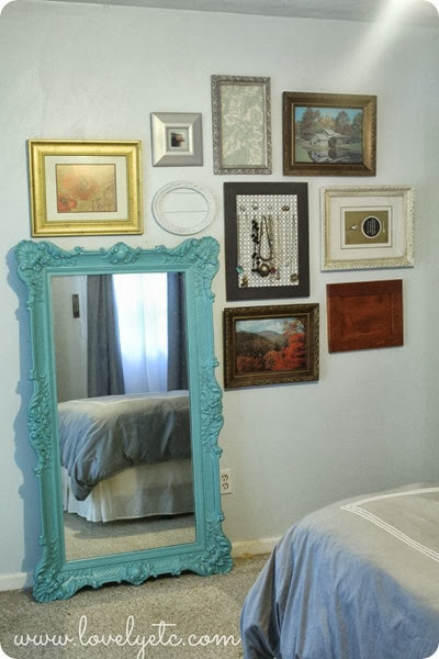 gallery wall around leaning mirror