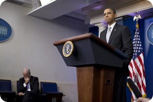 Vice President Joe Biden, left, listens as President Barack Obama pauses during remarks on the the fiscal cliff negotiations during a news conference in the briefing room of the White House on Wednesday, Dec. 19, 2012 in Washington.  Obama also announced that Biden will lead an administration-wide effort to curb gun violence in response to the Connecticut school shooting. (AP Photo/ Evan Vucci)