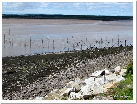 Salmon fisherman's poles across the river Cree estuary.