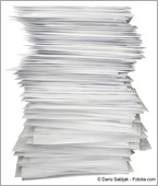 Piles up papers