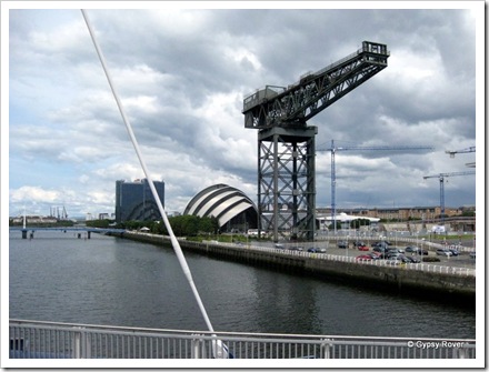 Ship builders crane in front of the "Armadillo" The Scottish Exhibition and theatre complex.