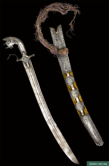 AN ARABIAN SILVER-HILTED SWORD AND SCABBARD, 19TH CENTURY