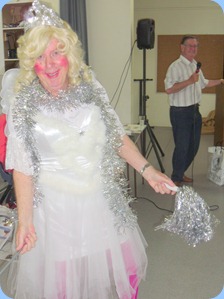 Fiona, the fairy, bringing Christmas cheer to the Prescott Club members whilst Len Hancy croons in the background