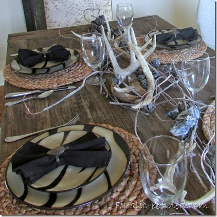 Rustic and refined tablescape using animal print dishes for a woodland theme