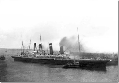 The "New York" being pushed away from the Titanic by tugs following the snapping of the cables.