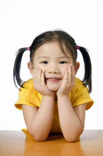 A young asian american girl smiling.  Education, Future