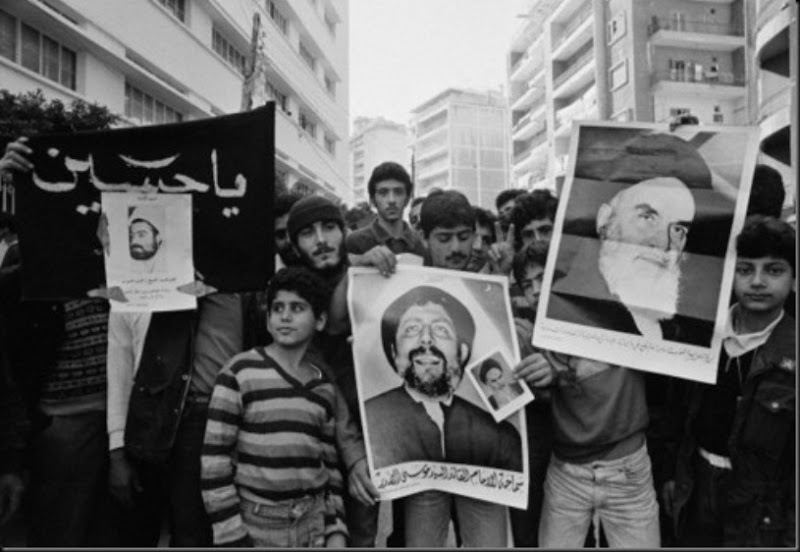 Demonstration of the Shiite political movement in Beirut. Protestants hold posters of Lebanese resistance leader and Muslim cleric Ragheb Harb