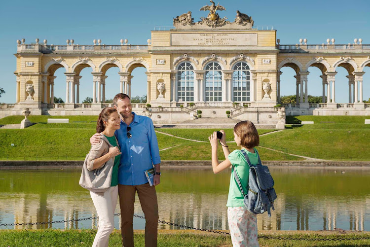 Posing in front of the Gloriette at Schönbrunn Palace in Vienna, Austria. The history of the palace and its vast gardens spans more than three centuries.