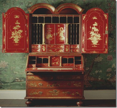 The red japanned bureau bookcase found in the State Bedroom at Erddig, Wrexham, Wales