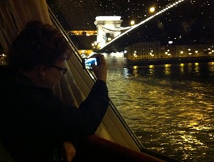 Melody and I are both trying to get picture on this dark rainy night with our iPhones from the boat on the Danube under the Chain Bridge