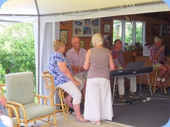 Attendees relaxing to the great music. The keyboard were set-up in the spacious garage come music room and which was extended by a large marquee to give us plenty of room and shelter from the lovely summer weather.
