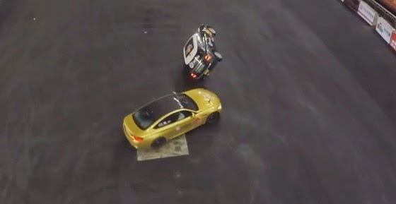 bmw-m4-sets-record-doing-10-donuts-around-car-driving-on-two-wheels-in-1-minute-video-89253-7 bmw-m4-sets-record-doing-10-donuts-around-car-driving-on-two-wheels-in-1-minute-video-89253-7