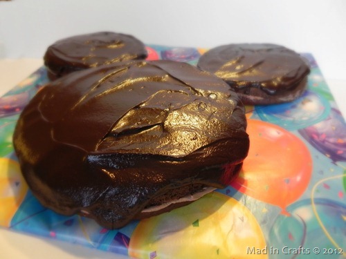 closeup of chocolate ganache on Mickey cake