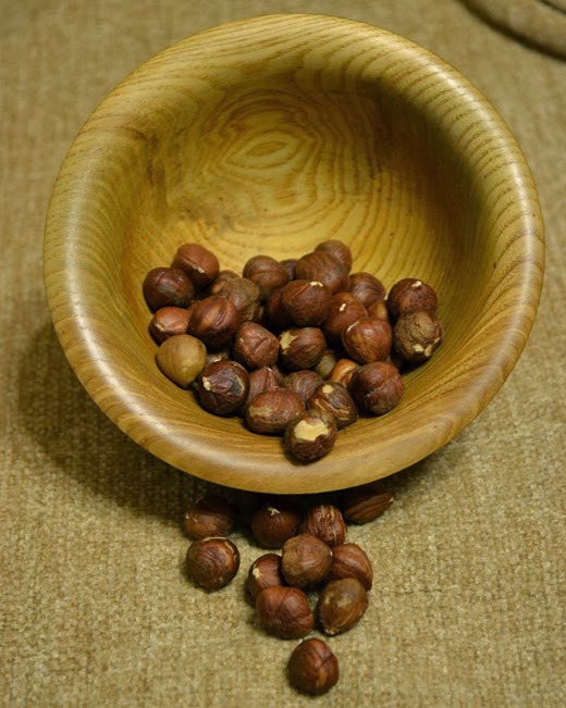 Hazelnuts spilling from a bowl