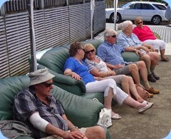 Some of the guests relaxing under the marquis and enjoying the music.