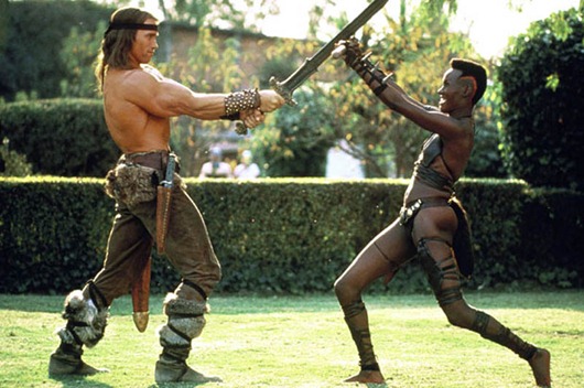 ARNOLD SCHWARZENEGGER & GRACE JONES<br />Film 'CONAN THE BARBARIAN' (1984)<br />29/06/1984<br />CTR58875<br />Allstar/Cinetext/UNIVERSAL<br />** WARNING** This photograph can only be reproduced by publications in conjuction with the promotion of the above film.