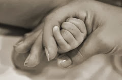 baby's hand in mom's
