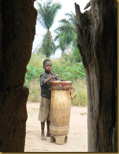Nkonko church - boy on drum