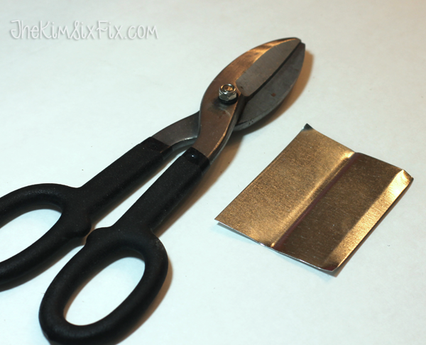 Cutting metal flashing for tags