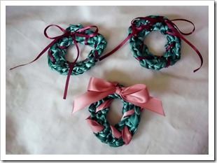 Crocheted ribbon Christmas wreaths.  Used for jewelry, hair accessories or decorations.