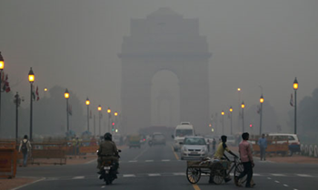 The India Gate monument in New Delhi, enveloped by a blanket of smog. An explosion of car use has made fast-growing Asian cities the epicentre of global air pollution and become, along with obesity, the world's fastest growing cause of death according to a major study of global diseases. Manish Swarup / AP