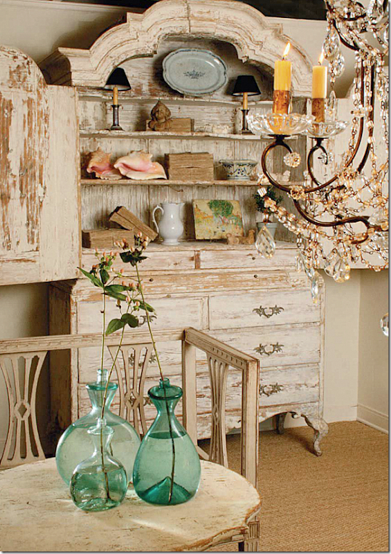 Swedish armoire and settee in an ad for Antique Shops and Designers - Jane Moore. European Country Interior Design by Jane Moore.