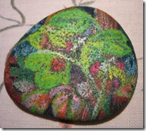 smooth black rock from beach with clover and ladybug drawn with colored pencil smooth black rock from beach with clover and ladybug drawn with colored pencil
