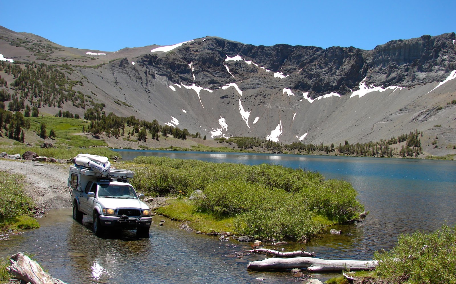 Our Four Wheel Camper Leavitt Lake "towing an ancient looking camper"