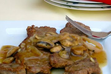 New York Strip with Mushroom Gravy and Caramelized Onions